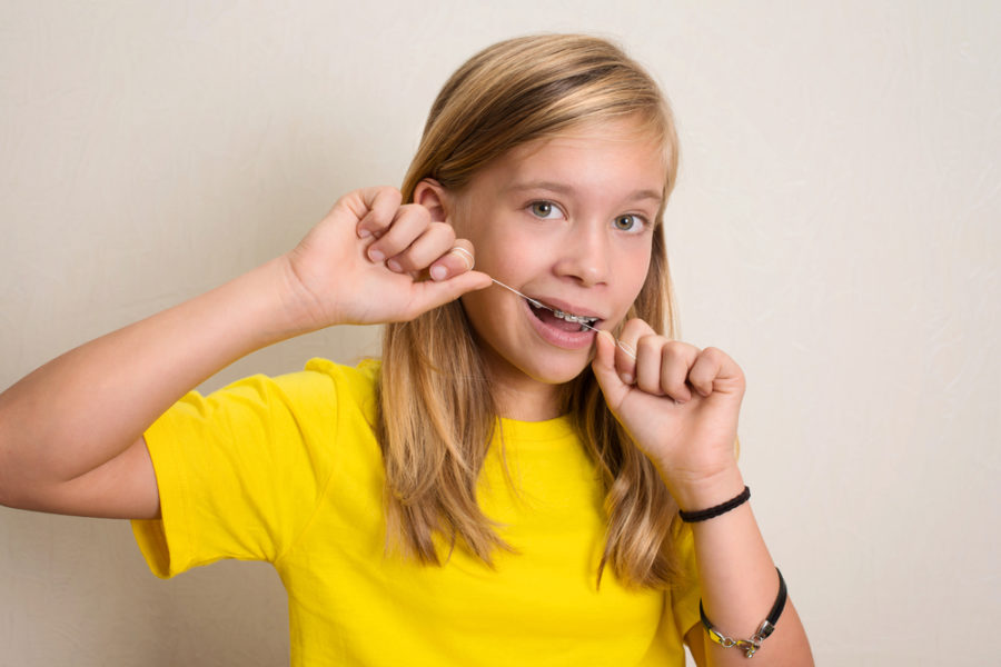 how to floss with braces